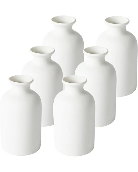 Close-up of one modern white boho vase, showcasing its smooth ceramic finish and texture.