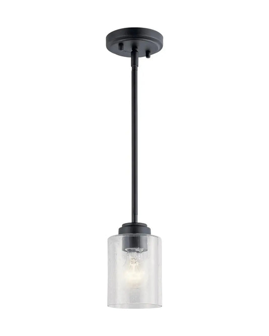Angled perspective of the mini pendant light, highlighting its textured clear seeded glass and matte black hardware deta