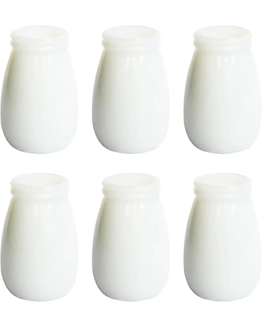 Close-up of one modern white boho vase, showcasing its smooth ceramic finish and texture.