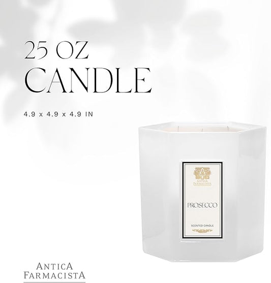 The lit candle casting a soft, warm glow on a tabletop, creating an inviting ambiance in a living space.