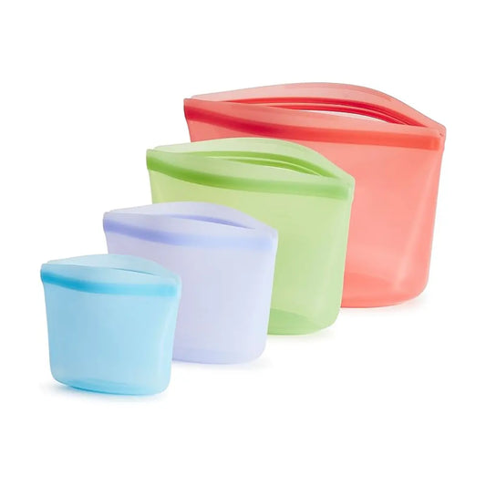 Four Stasher bags of different sizes and vibrant colors, arranged for display.