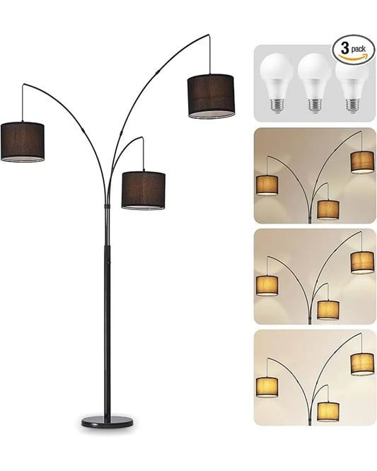 Full view of the 3-light modern black tree floor lamp with black shades in a living room.