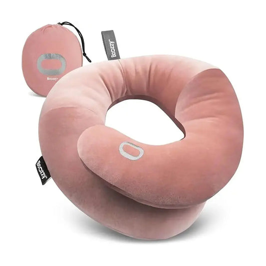 Nude-colored travel neck pillow with patented double support for head, neck, and chin.