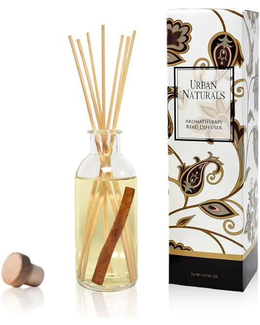 Close-up of the Cinnamon Vanilla diffuser bottle, showing the warm-toned oil and reeds, suggesting a cozy scent.