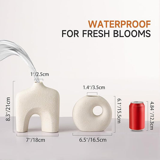 Close-up of one off-white donut vase, highlighting its unique round shape and smooth finish.