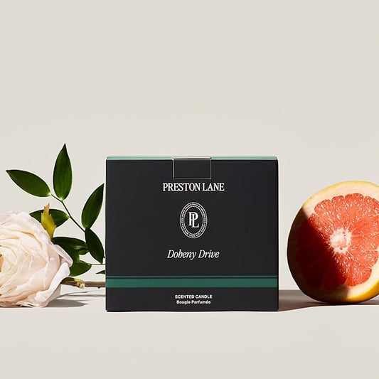 Close-up of the three wicks and smooth vegan soy wax blend surface inside the ceramic jar.