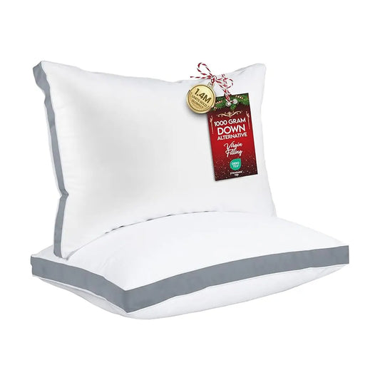 Close-up of the smooth grey fabric and crisp gusseted edge of a single bed pillow.