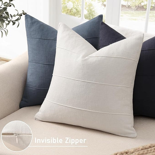 Close-up of the handcrafted striped texture and soft linen fabric of a pillow cover.