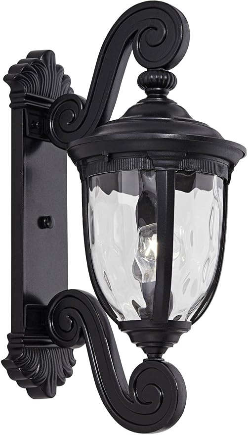 Close-up of the texturized black finish and clear hammered glass panels of the outdoor wall light.