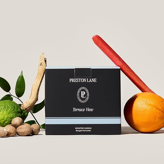 Close-up of the three wicks and smooth vegan soy wax blend surface inside the ceramic jar.