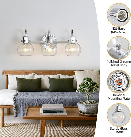 Close-up of the polished chrome finish and a clear glass globe shade on the vanity light fixture.