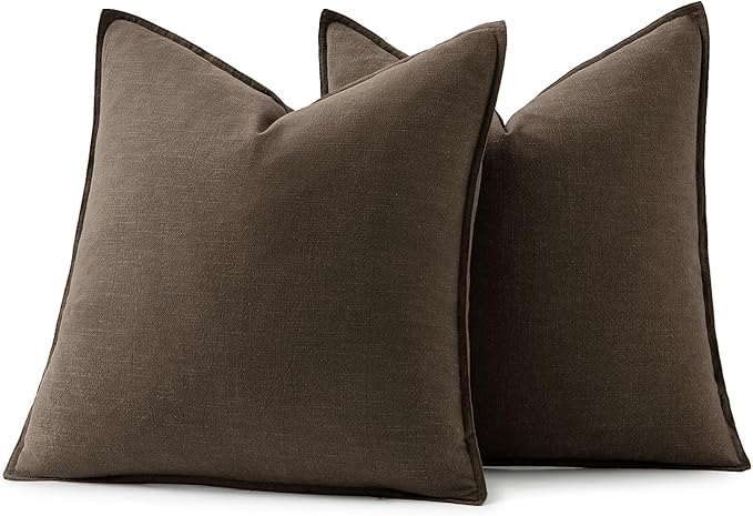 Dark coffee linen pillow covers arranged in a living room, complementing a cozy home environment.