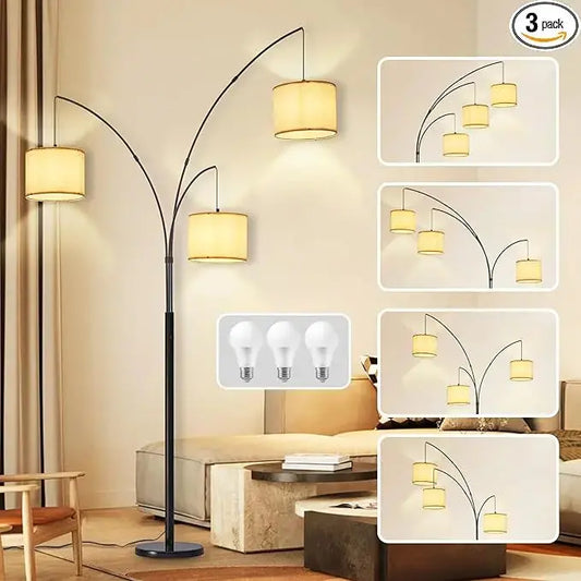 Full view of the 3-light modern black tree floor lamp with beige shades in a living room.