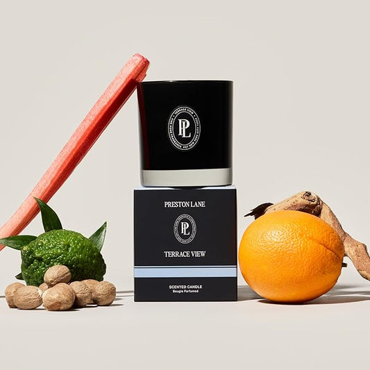 Close-up of the two wicks and smooth vegan soy wax blend surface inside the glass candle.