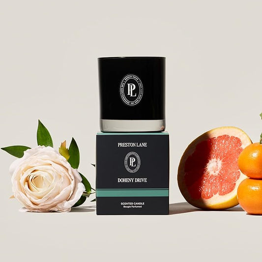 Close-up of the two wicks and smooth vegan soy wax blend surface inside the glass candle.