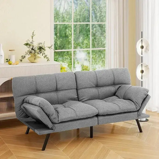 Close-up of the silver grey fabric texture on the futon sofa bed's detachable cushion, showing the weave.