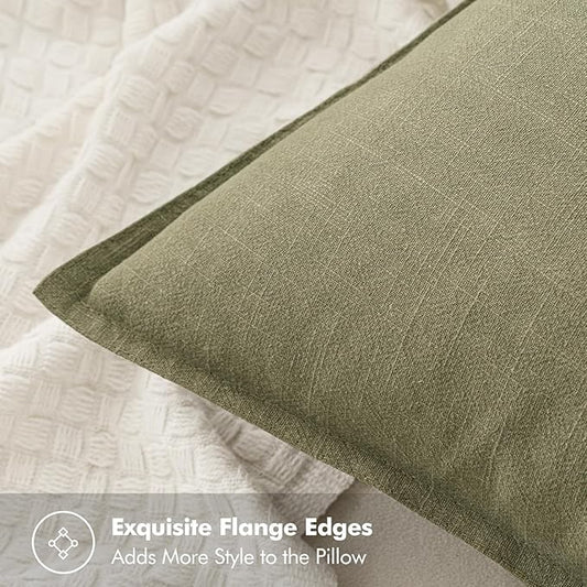 Close-up of the textured light olive green linen fabric, showing its subtle variations and organic appeal.