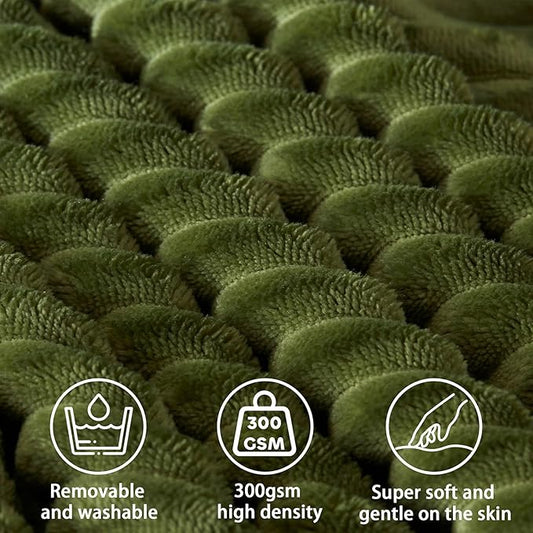 Close-up of the textured fabric on the removable cover of the green wedge pillow.