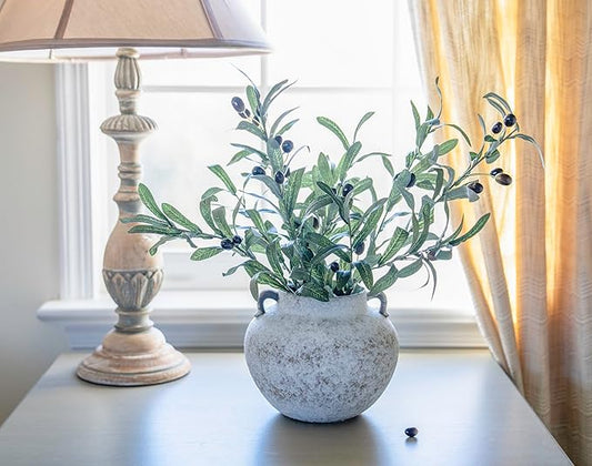 Close-up of the textured pottery surface, highlighting the rustic white glaze and subtle variations.