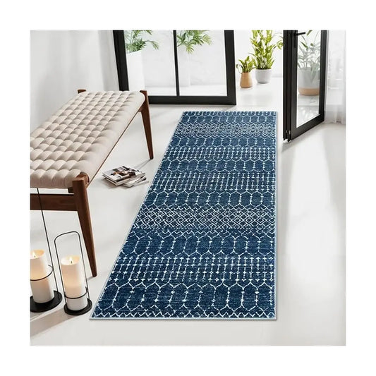 Close-up of the blue and white geometric pattern on the low-pile runner rug surface.