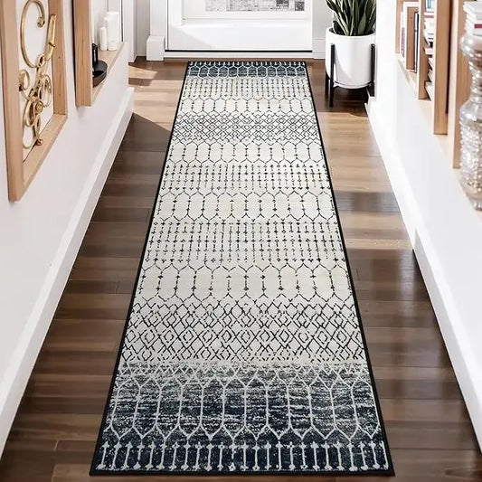 Overhead view of the full runner rug, showcasing its length and modern black geometric design.