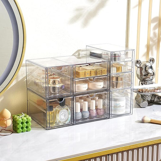 The 9-drawer acrylic organizer displayed on an office desk, filled with various supplies.