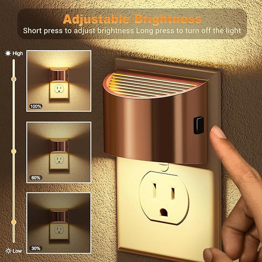 Rose gold LED night light plugged into a wall outlet, emitting a soft white 3000K glow.