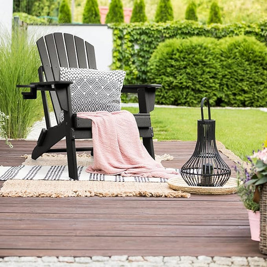 Close-up view of a single white HDPE Adirondack chair, emphasizing its sturdy build and comfortable recline.