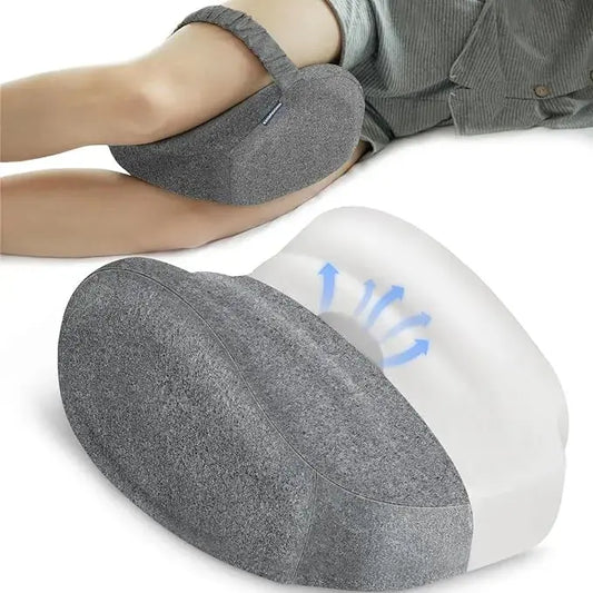 Memory foam leg pillow with an adjustable strap, viewed from the side for stability.