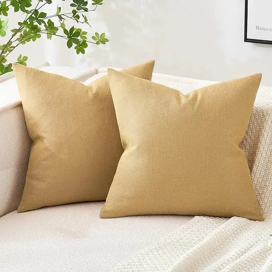 Close-up view of the mustard yellow linen burlap fabric texture on the pillow cover.