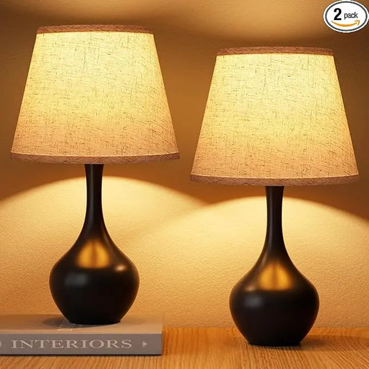 Close-up of a single black table lamp, showcasing its minimalist design and touch-sensitive base.