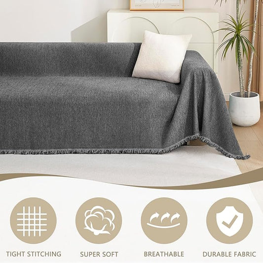 Close-up of the thick chenille fabric texture of the charcoal gray sofa cover, showing its soft feel.