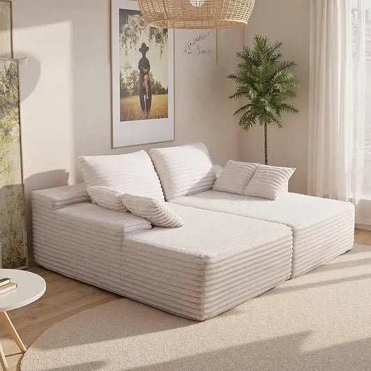 Close-up of the soft corduroy fabric and plush cushions of the lounge.