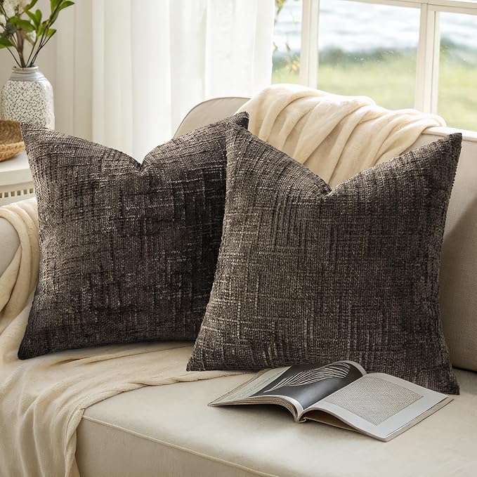 Another angle of dark brown chenille pillow covers complementing a sofa in a living room setting.