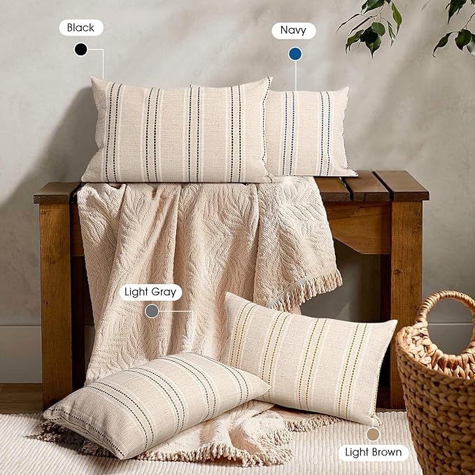 Angled view of the beige and brown striped throw pillow cover, showcasing the durable stitching and fabric quality.