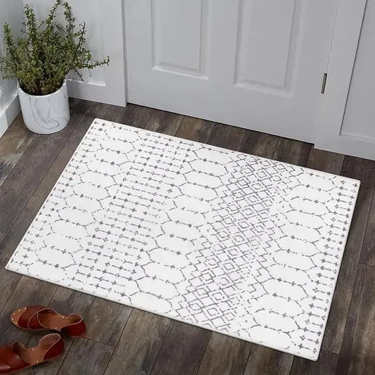 Overhead view of the small door mat, showcasing its full geometric design and color scheme.