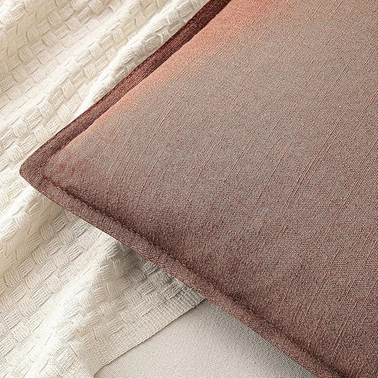 Close-up view of the rust red linen fabric, highlighting its subtle woven texture.
