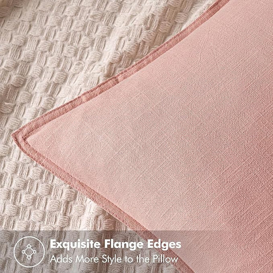 Close-up view of the pink linen fabric, highlighting its subtle woven texture.