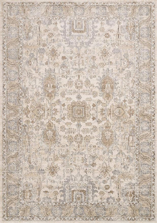 Overhead shot of the soft neutral ivory and sand accent rug on a light carpet.
