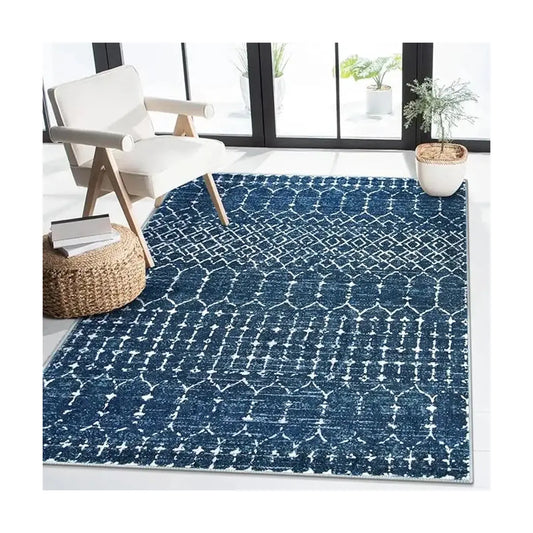 Close-up of the ultra-thin pile and intricate geometric pattern on the blue area rug.