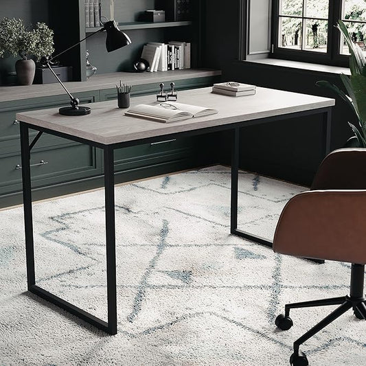 The office desk displayed in a stylish home office setting, showcasing its modern design.