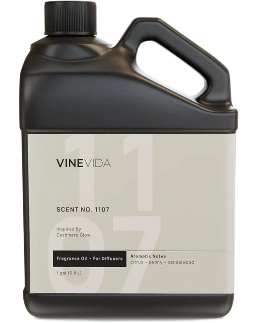 Scent NO. 1107 fragrance oil bottle next to a cold air diffuser, enhancing a modern living space.