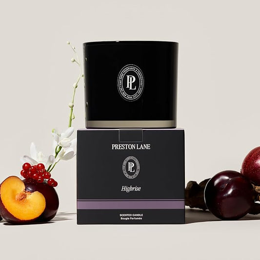 Close-up of the three wicks and smooth vegan soy wax blend surface inside the ceramic jar.