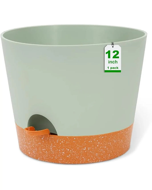A 12-inch green self-watering plastic planter, suitable for large indoor or outdoor flowers.