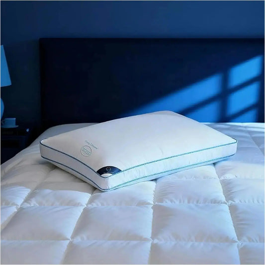A single King Size 17"x 33" bed pillow featuring 37.5® temperature regulating technology, on a neatly made bed.