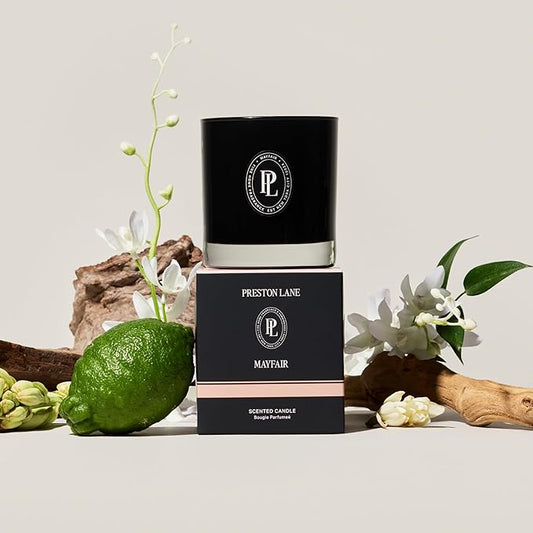 Close-up of the two wicks and smooth vegan soy wax blend surface inside the glass candle.