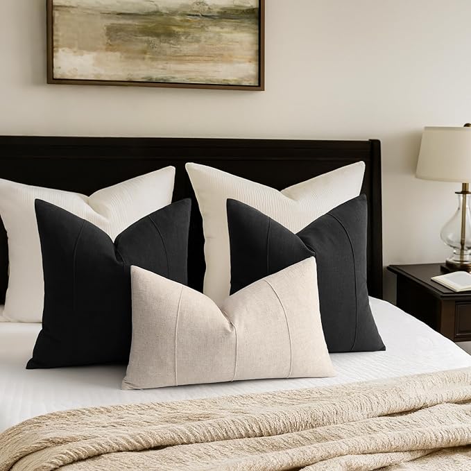 Fabric swatch close-up, illustrating the weave and color of the cream white linen material.