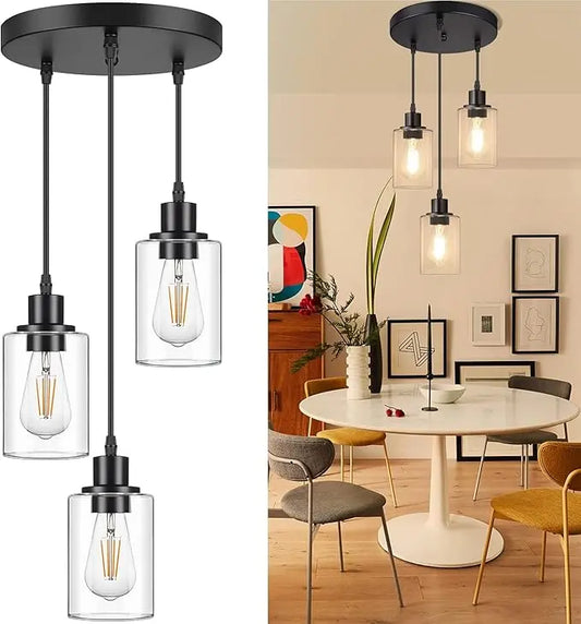 An industrial black 3-light pendant light with clear glass shades, hanging from a ceiling.