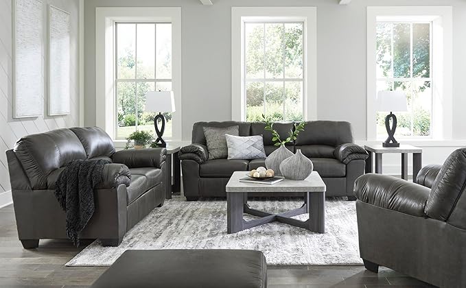 The sofa in a brightly lit room, showcasing the exact shade of gray under natural light.