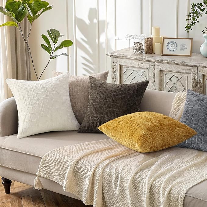 View of the hidden zipper closure along the edge of the dark brown chenille throw pillow cover.
